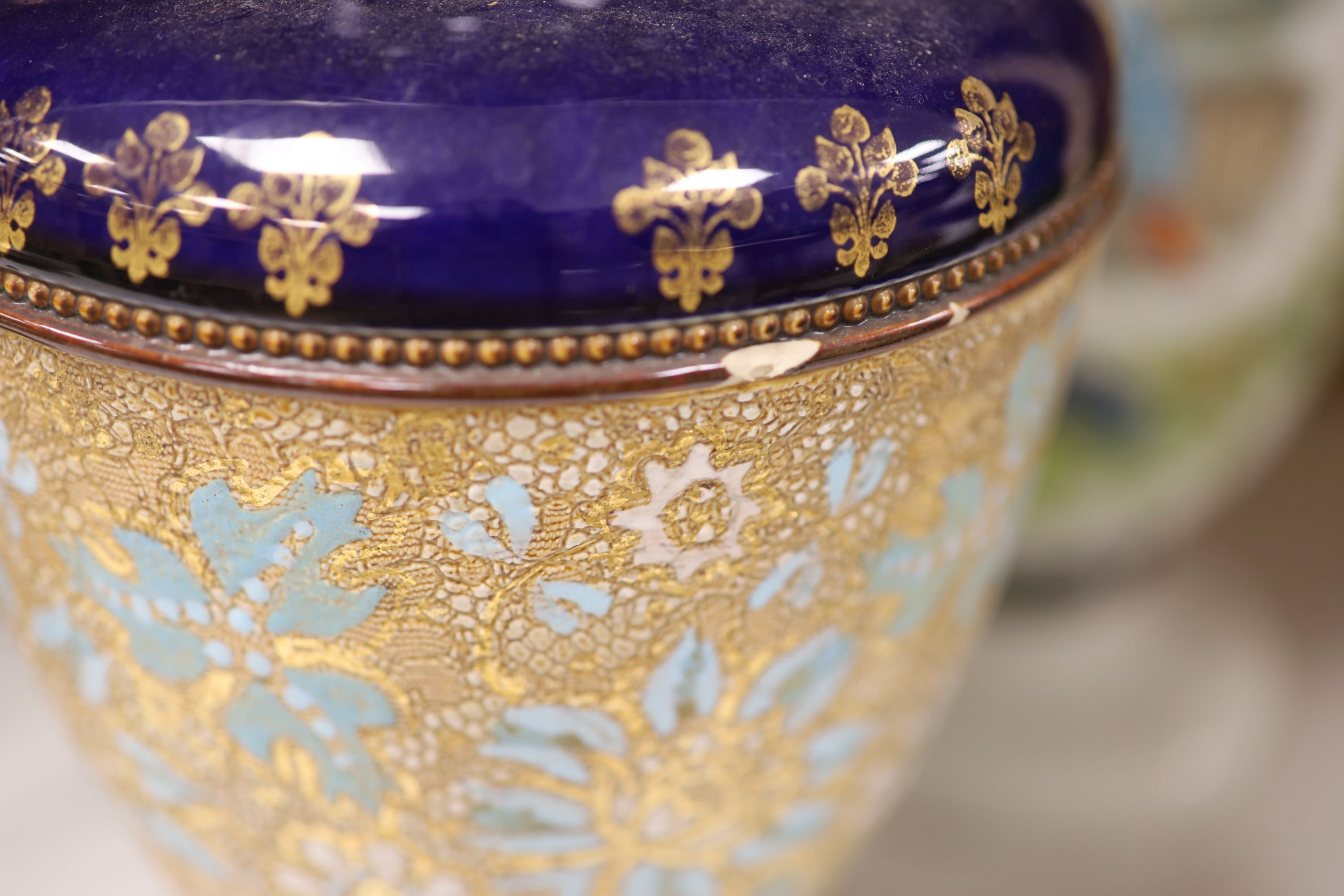 A pair of Doulton Slater stoneware vases and a pair of opalescent glass vases, height 37cm